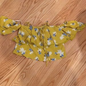 a tank top with off the shoulder sleeves